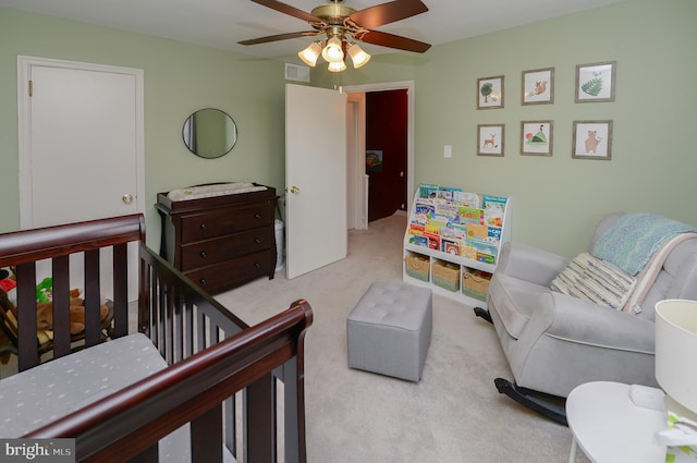 carpeted bedroom featuring ceiling fan