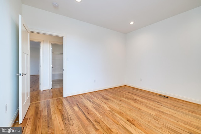 spare room with light wood-type flooring