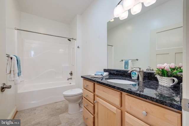 full bathroom featuring vanity, bathing tub / shower combination, and toilet