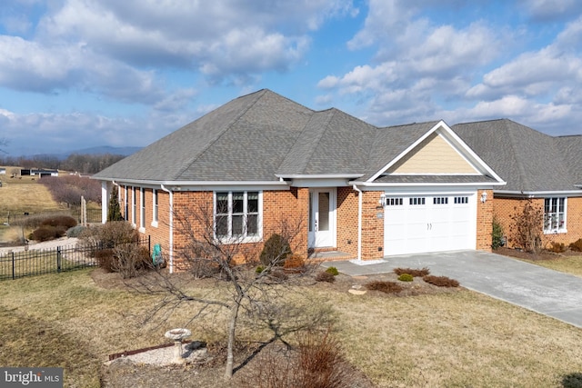 view of front facade with a garage and a front lawn