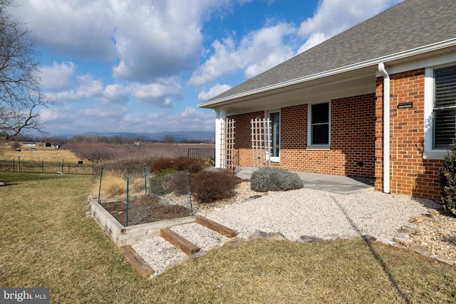 view of yard featuring a rural view and a patio