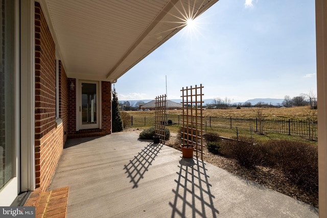 view of patio / terrace with a rural view