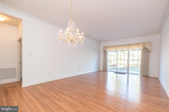 unfurnished room with ornamental molding, light hardwood / wood-style floors, and a chandelier