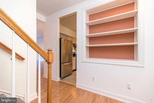 hallway with light wood-type flooring