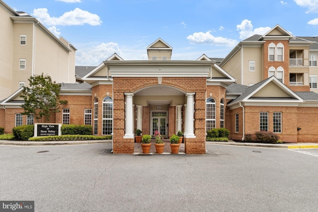 400 Symphony Cir Unit 136E, Cockeysville, MD 21030 - view of building exterior with uncovered parking