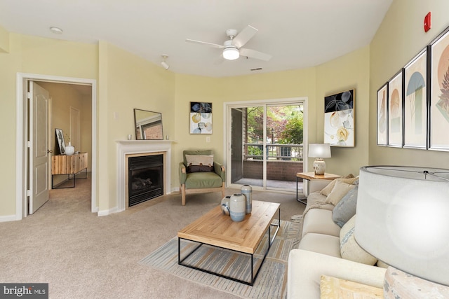 400 Symphony Cir Unit 136E, Cockeysville, MD 21030 - living area featuring light carpet, ceiling fan, a fireplace, and baseboards