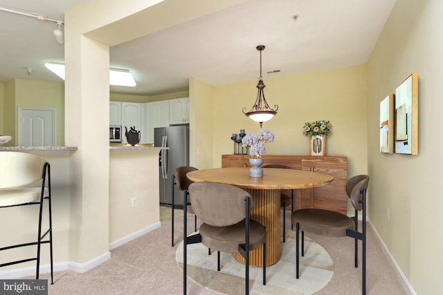 400 Symphony Cir Unit 136E, Cockeysville, MD 21030 - dining room with light colored carpet and baseboards