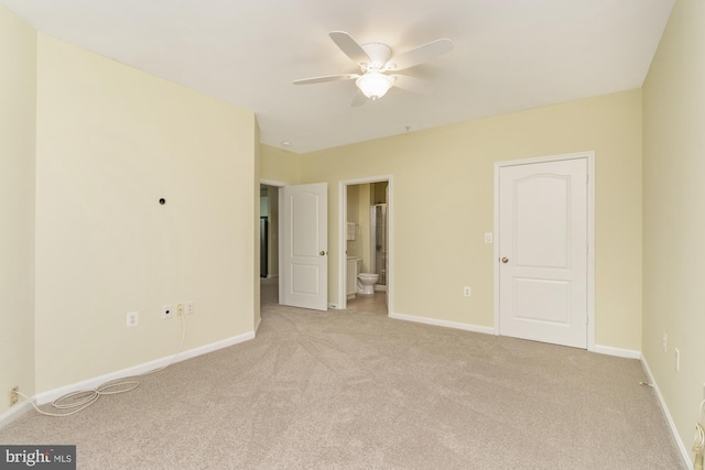 400 Symphony Cir Unit 136E, Cockeysville, MD 21030 - unfurnished bedroom with light colored carpet, baseboards, ensuite bath, and a ceiling fan