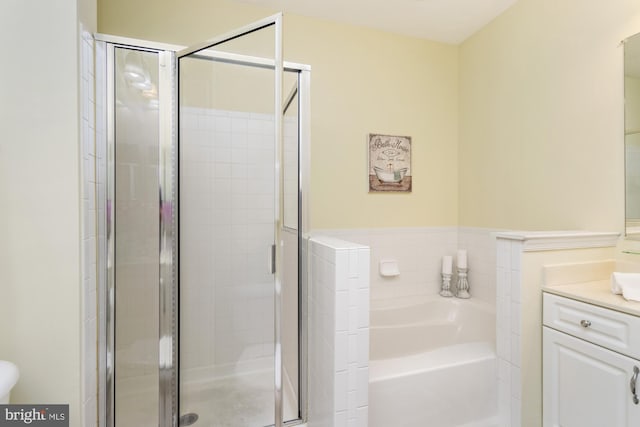 400 Symphony Cir Unit 136E, Cockeysville, MD 21030 - bathroom with vanity, a bath, and a stall shower