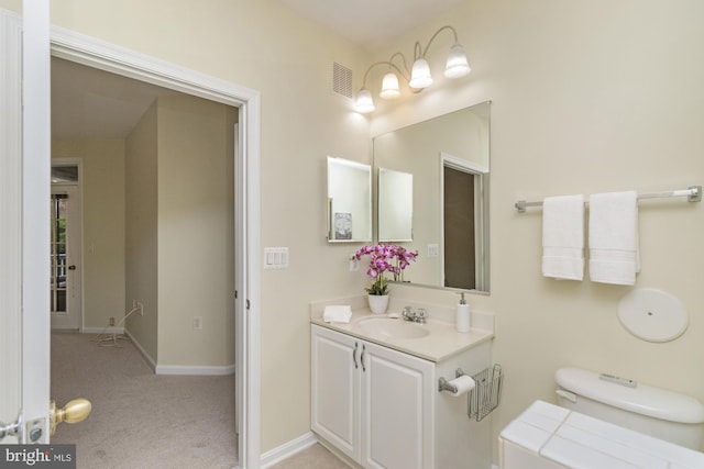 400 Symphony Cir Unit 136E, Cockeysville, MD 21030 - bathroom featuring vanity, baseboards, and toilet