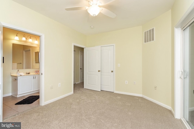 400 Symphony Cir Unit 136E, Cockeysville, MD 21030 - unfurnished bedroom featuring light carpet, ensuite bathroom, and baseboards