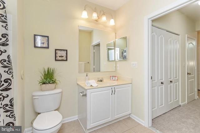 400 Symphony Cir Unit 136E, Cockeysville, MD 21030 - full bath featuring toilet, vanity, baseboards, and tile patterned flooring