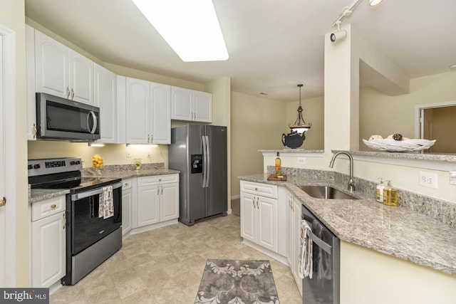 400 Symphony Cir Unit 136E, Cockeysville, MD 21030 - kitchen with appliances with stainless steel finishes, a sink, light stone countertops, and white cabinets