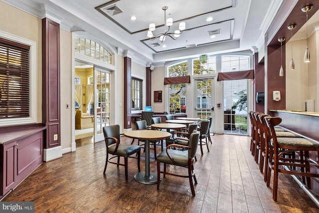 400 Symphony Cir Unit 136E, Cockeysville, MD 21030 - dining room with dark wood-type flooring, a chandelier, a raised ceiling, recessed lighting, and ornamental molding