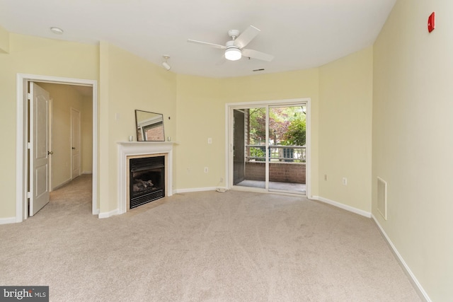400 Symphony Cir Unit 136E, Cockeysville, MD 21030 - unfurnished living room with carpet, a ceiling fan, a fireplace, and baseboards