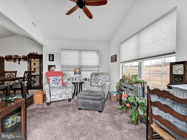 sitting room featuring lofted ceiling, ceiling fan, and carpet