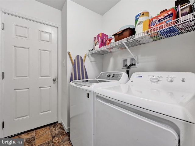 clothes washing area featuring washing machine and clothes dryer