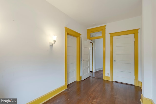 empty room featuring dark hardwood / wood-style flooring