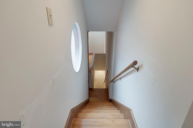 stairway featuring hardwood / wood-style flooring