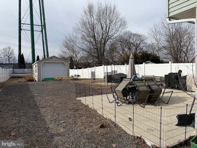 view of yard featuring an outbuilding and a garage