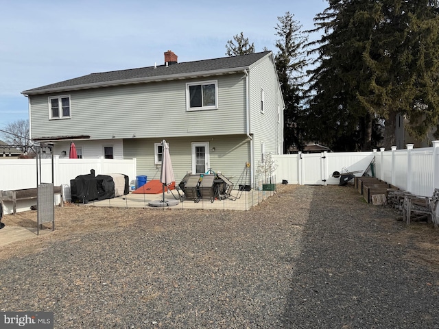 back of property featuring a patio