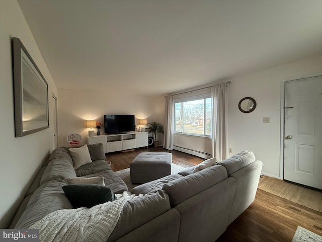 living room featuring baseboard heating and wood-type flooring