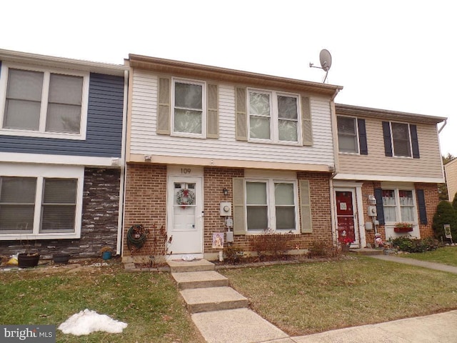 view of property with a front lawn