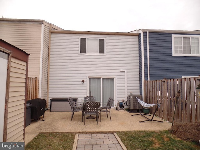 back of property featuring central AC and a patio area