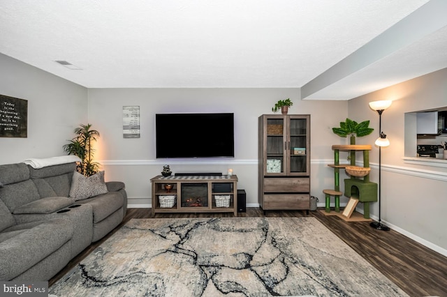 living room with dark wood-type flooring