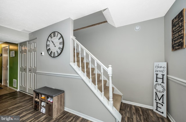 staircase featuring hardwood / wood-style flooring