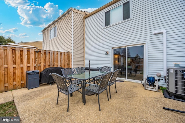 view of patio / terrace featuring a grill and central air condition unit