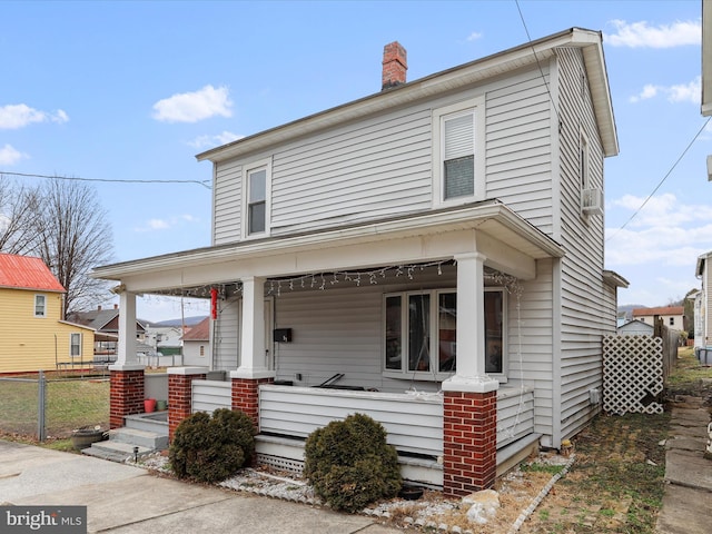 view of front of property featuring covered porch