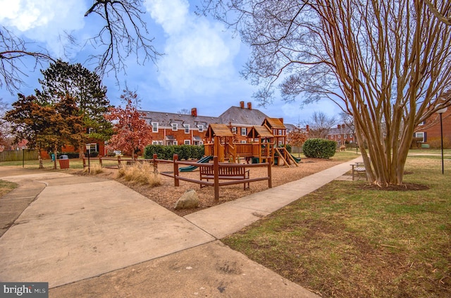 view of jungle gym featuring a lawn