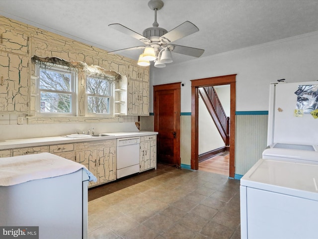 kitchen featuring crown molding, white appliances, sink, and washer and dryer