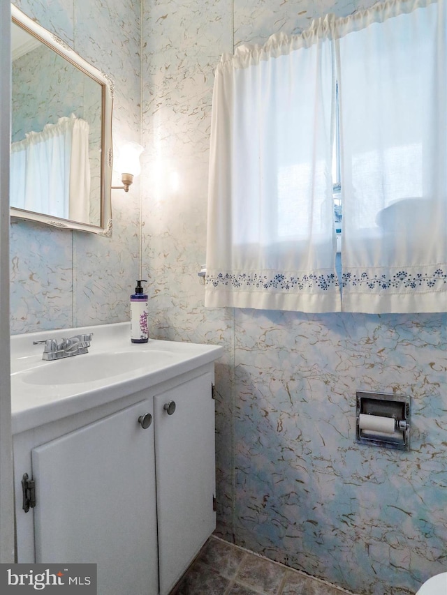 bathroom featuring tile patterned flooring and vanity