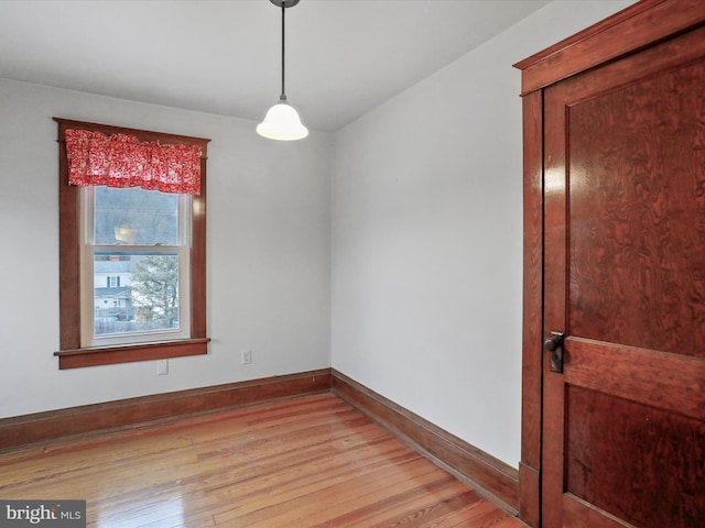 spare room featuring light wood-type flooring