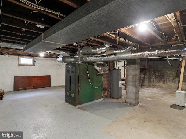 basement featuring water heater and heating unit