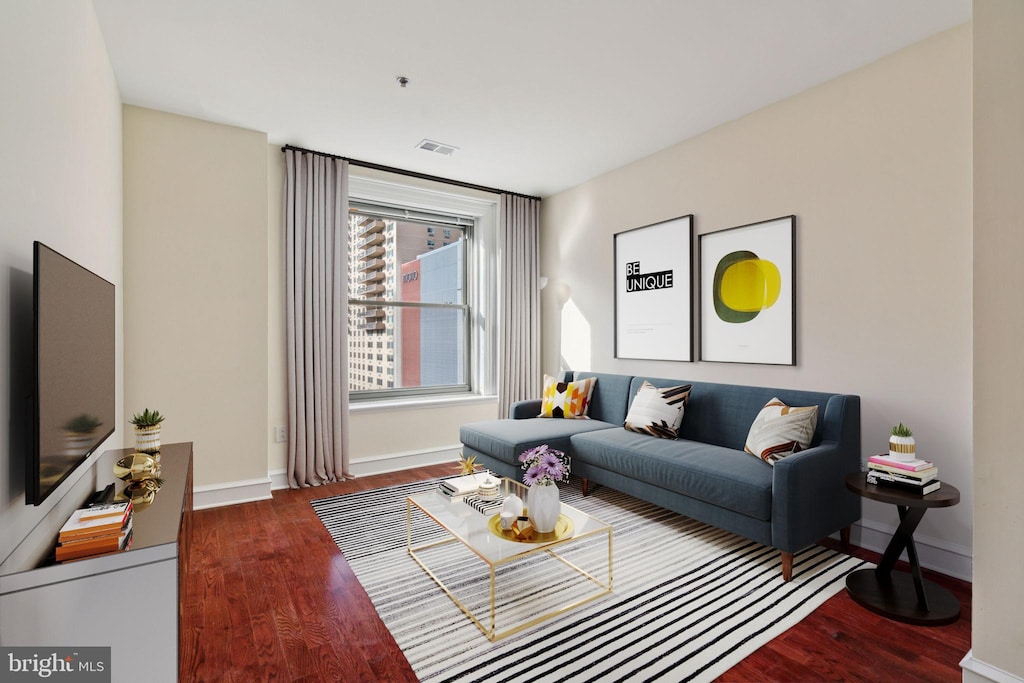 living room featuring dark hardwood / wood-style floors