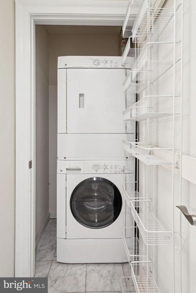 laundry area featuring stacked washer and dryer