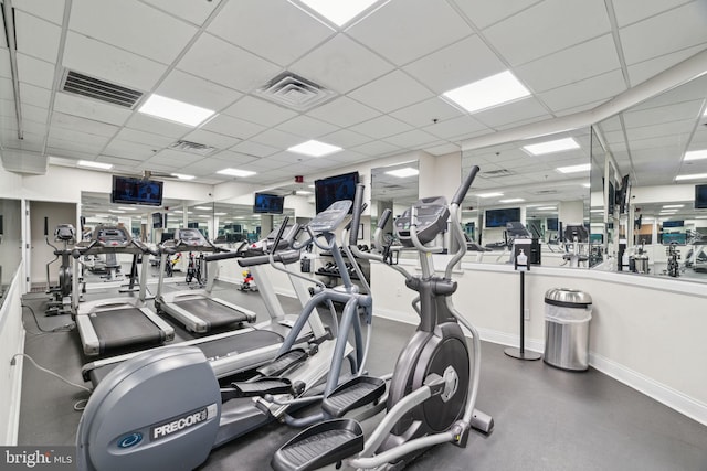 workout area featuring a drop ceiling