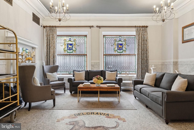 living room featuring crown molding and a chandelier