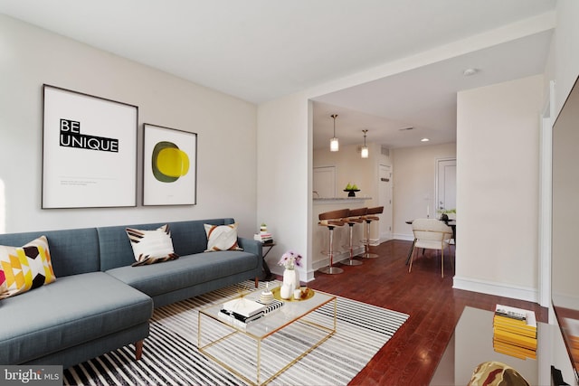 living room with dark wood-type flooring