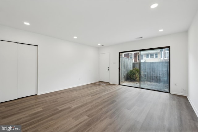 empty room featuring hardwood / wood-style flooring