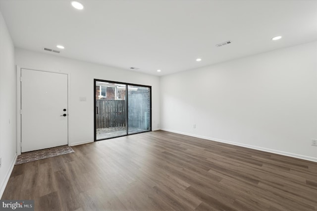 empty room featuring dark hardwood / wood-style floors