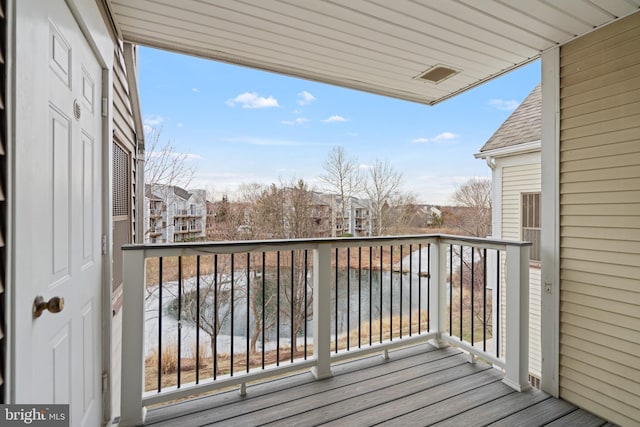 balcony featuring a water view