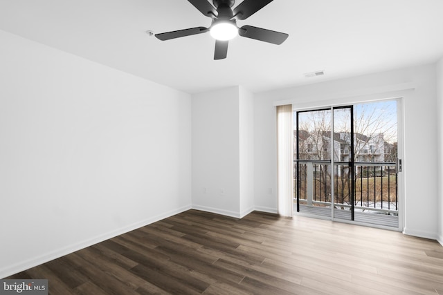 unfurnished room with hardwood / wood-style flooring