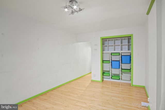 empty room featuring wood-type flooring