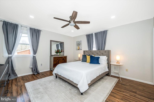 bedroom with ceiling fan, baseboards, dark wood-type flooring, and recessed lighting