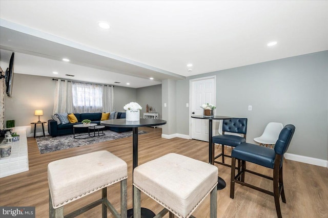 dining area with wood finished floors and baseboards