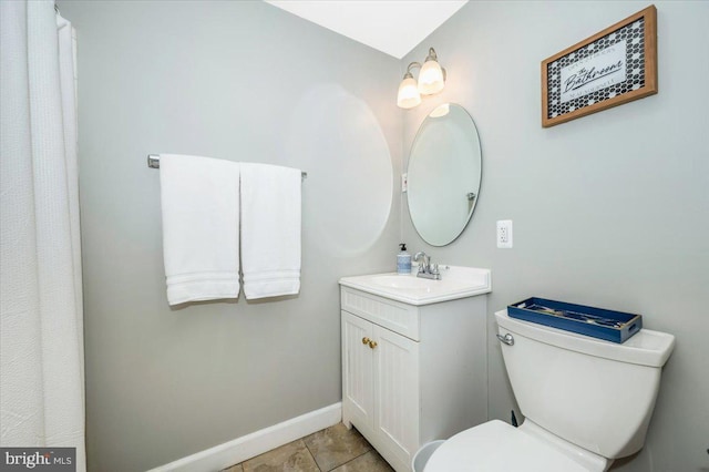 full bathroom with baseboards, vanity, toilet, and tile patterned floors